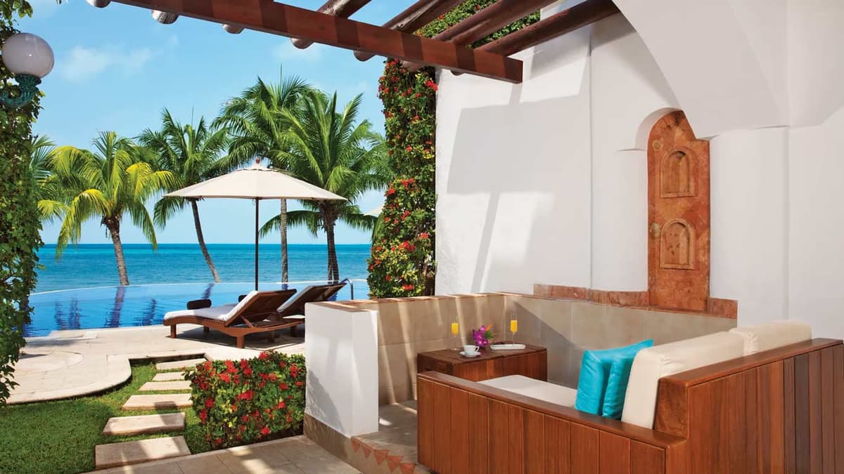 Junior Suite Veranda terrace with direct pool access and Caribbean Sea views