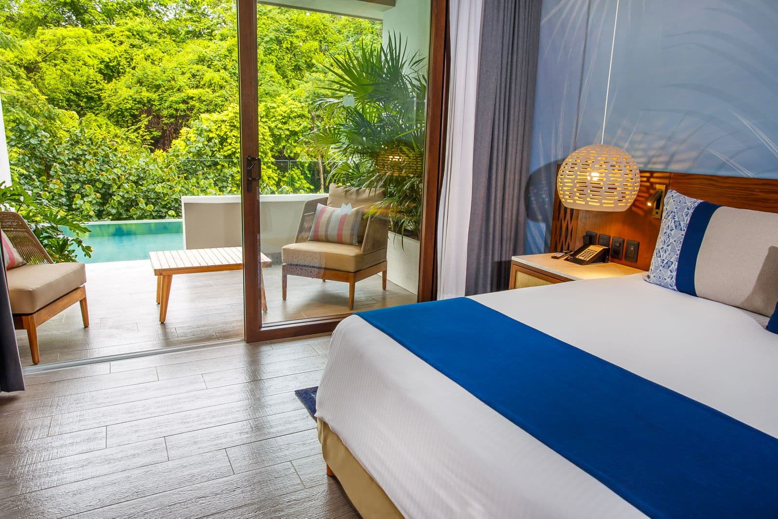 Swim-out suite with private plunge pool, jungle views, and modern tropical decor