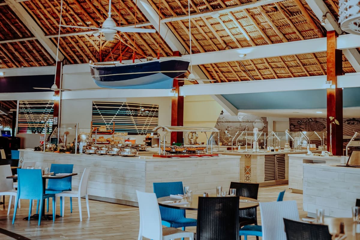 Calypso buffet restaurant with open show kitchen serving breakfast, lunch, and themed dinners