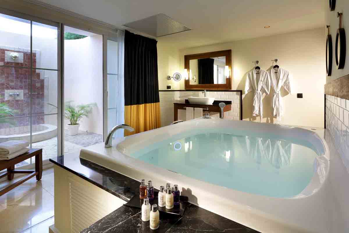 Panoramic view of Grand Palladium Lady Hamilton Resort with low-rise buildings nestled among palm trees along Jamaica north coast