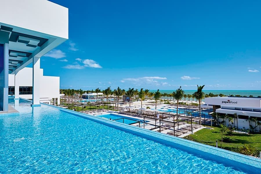 Swimming pool area at Hotel Riu Palace Costa Mujeres