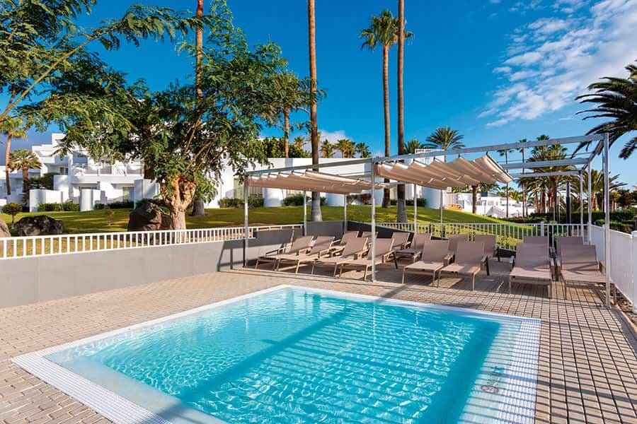 Swimming pool area at Hotel Riu Paraiso Lanzarote