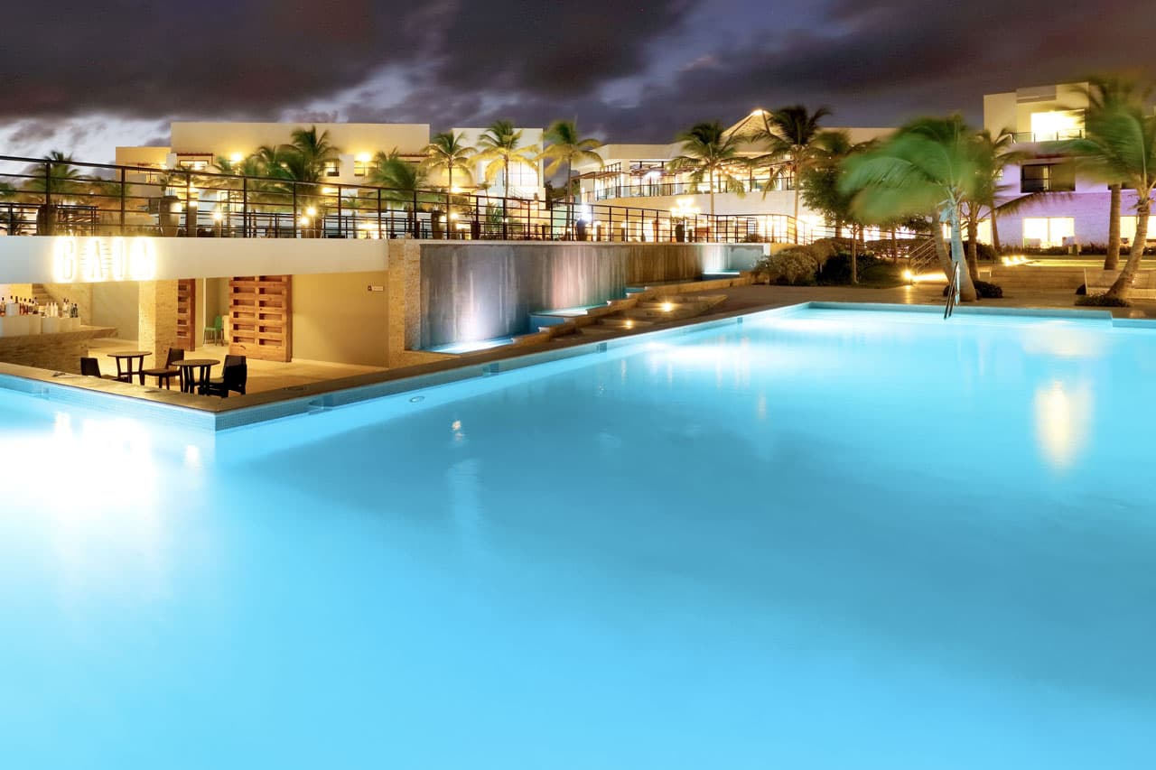 Pool area with loungers and Caribbean views at TRS Cap Cana