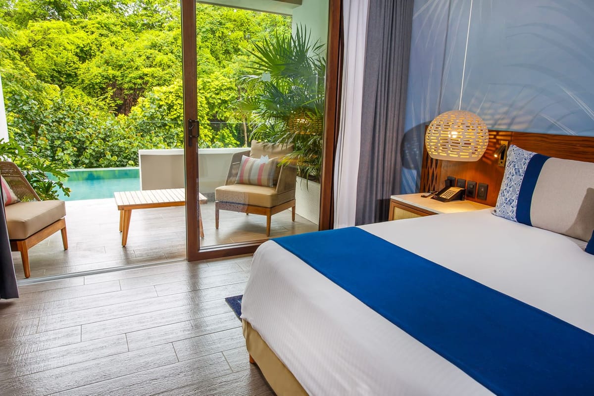 Swim-out suite with private plunge pool, jungle views, and modern tropical decor