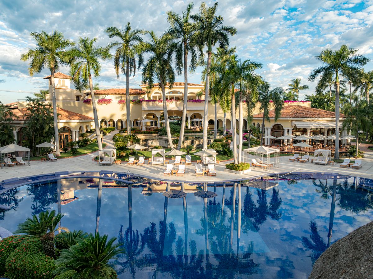 Main resort pool with swim-up Aqua Bar and cabanas