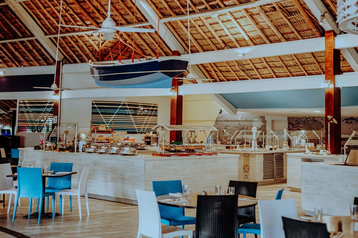 Calypso buffet restaurant with open show kitchen serving breakfast, lunch, and themed dinners
