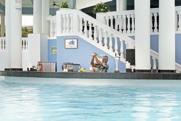 Infinite Indulgence all-inclusive experience at Grand Palladium Jamaica showing dining, pool, beach, and Caribbean lifestyle
