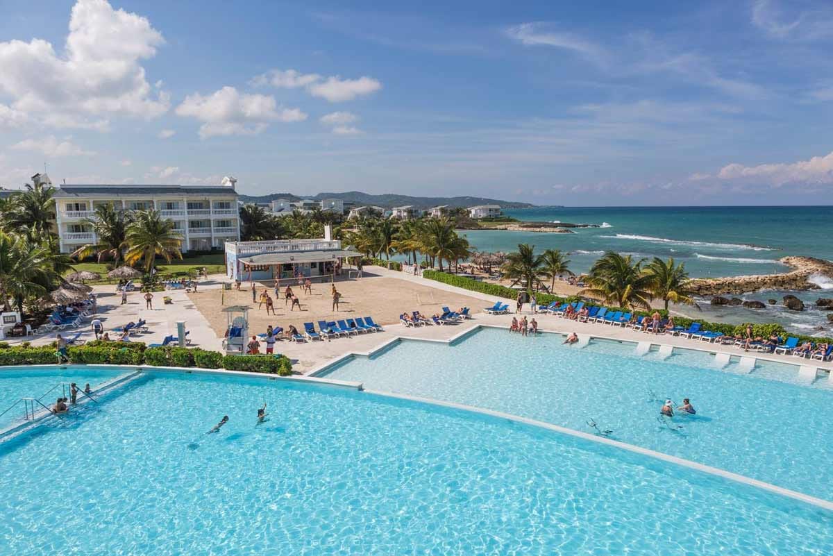 Sunset Cove beach at Grand Palladium Jamaica with calm, clear Caribbean waters in a protected natural cove ideal for families
