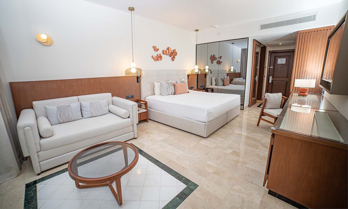 Junior Suite Garden View with king bed and tropical garden views