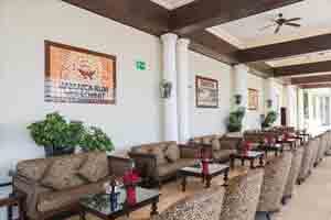 Infinity Lobby Bar at Grand Palladium Lady Hamilton with outdoor terrace, Caribbean Sea views, live music, and sunset cocktails