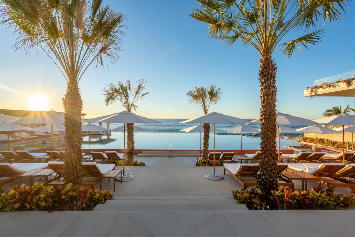 Heated infinity pool cascading toward the Sea of Cortez