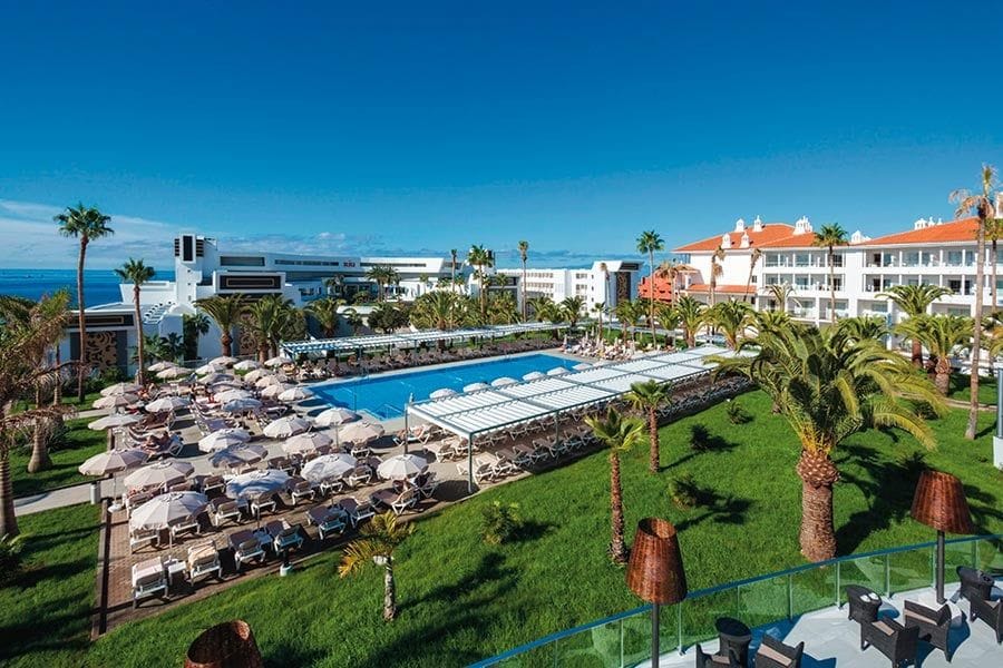 Swimming pool area at Hotel Riu Arecas