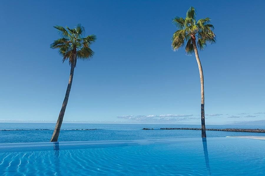 Swimming pool area at Hotel Riu Arecas
