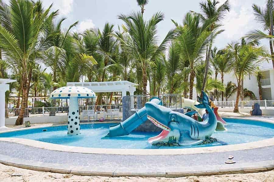 Swimming pool area at Hotel Riu Bambu