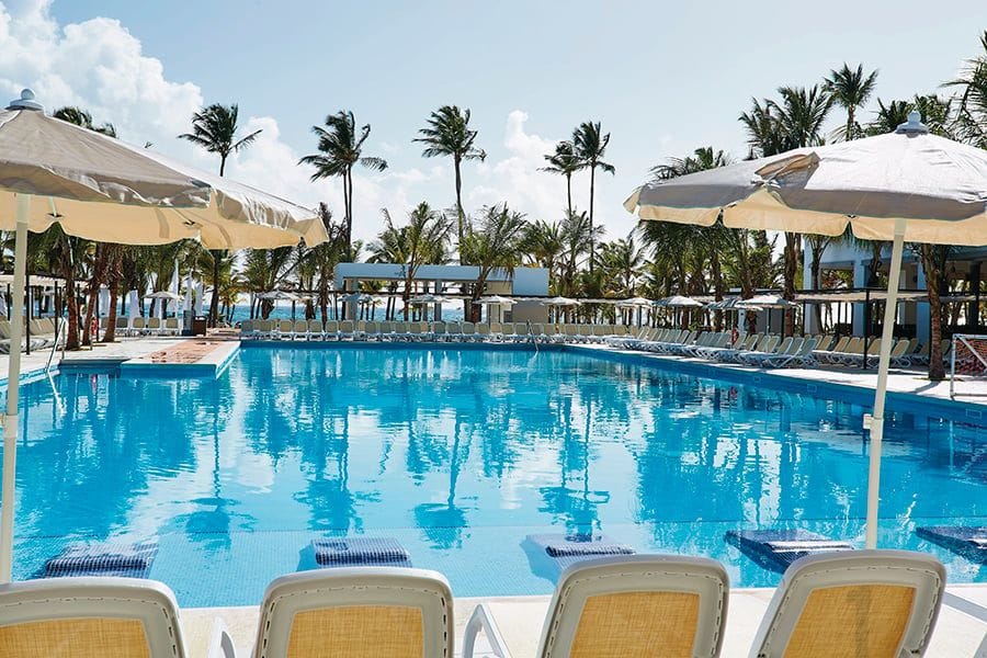 Swimming pool area at Hotel Riu Bambu