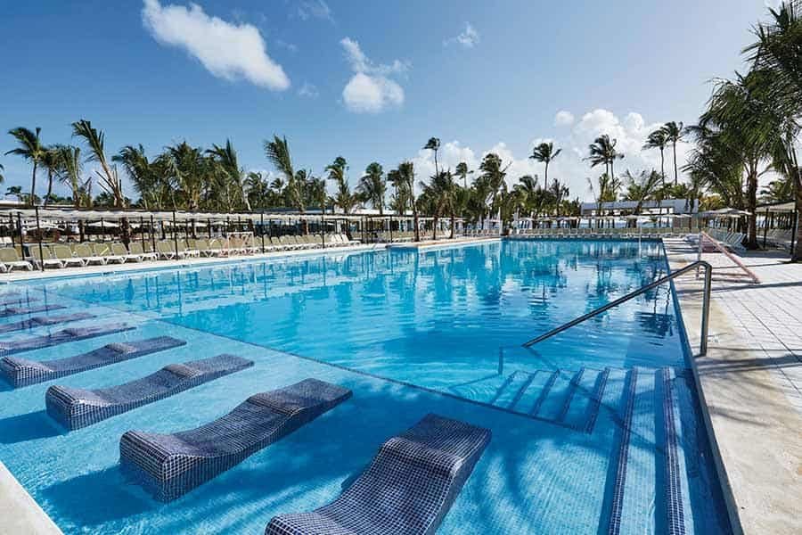 Swimming pool area at Hotel Riu Bambu