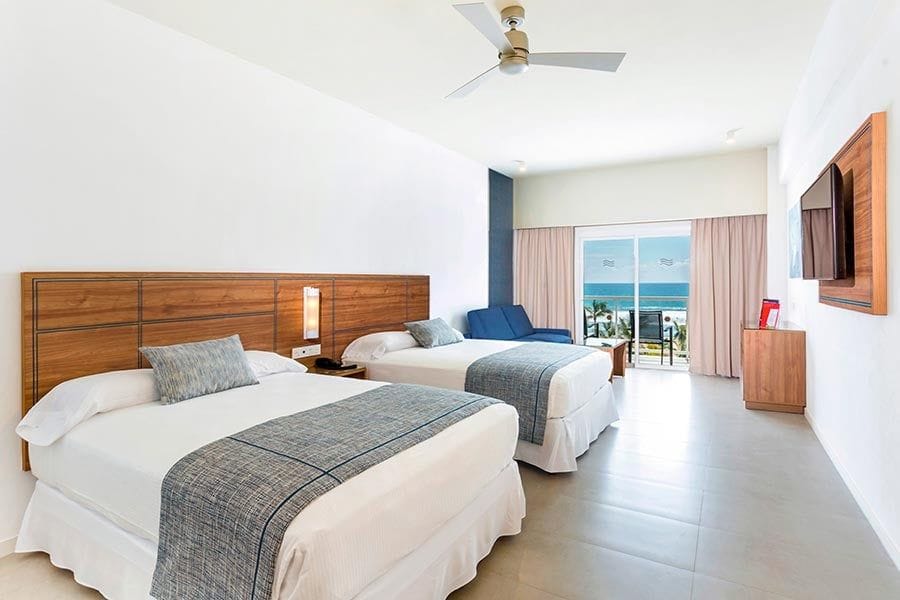 Guest room at Hotel Riu Emerald Bay