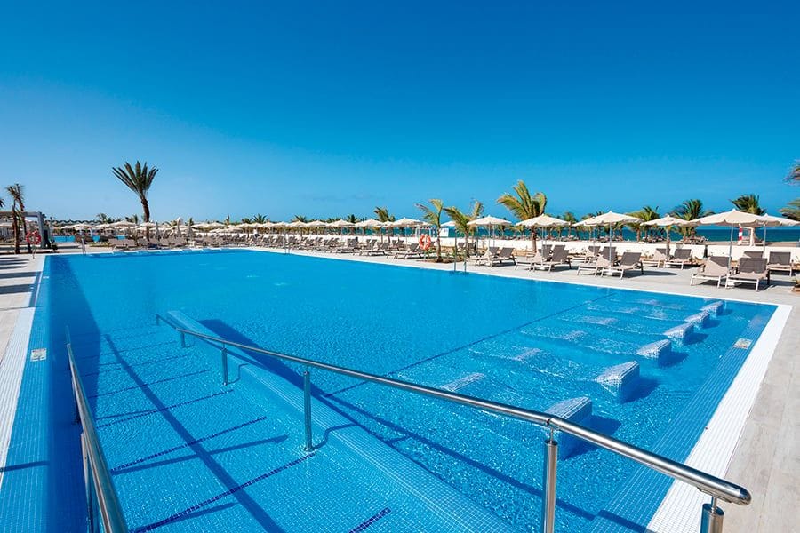 Swimming pool area at Hotel Riu Karamboa