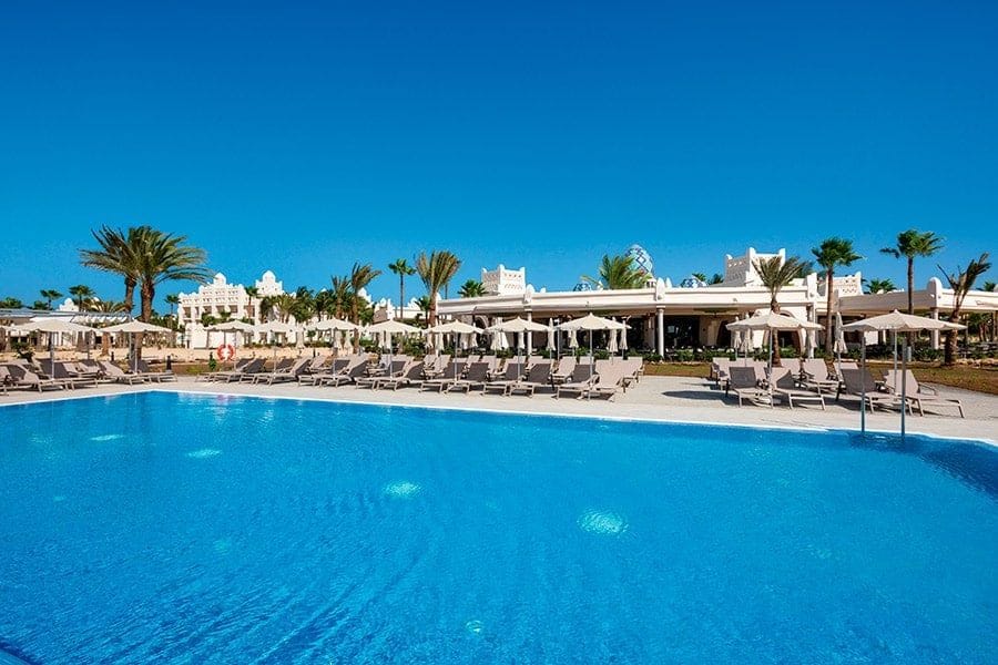 Swimming pool area at Hotel Riu Karamboa