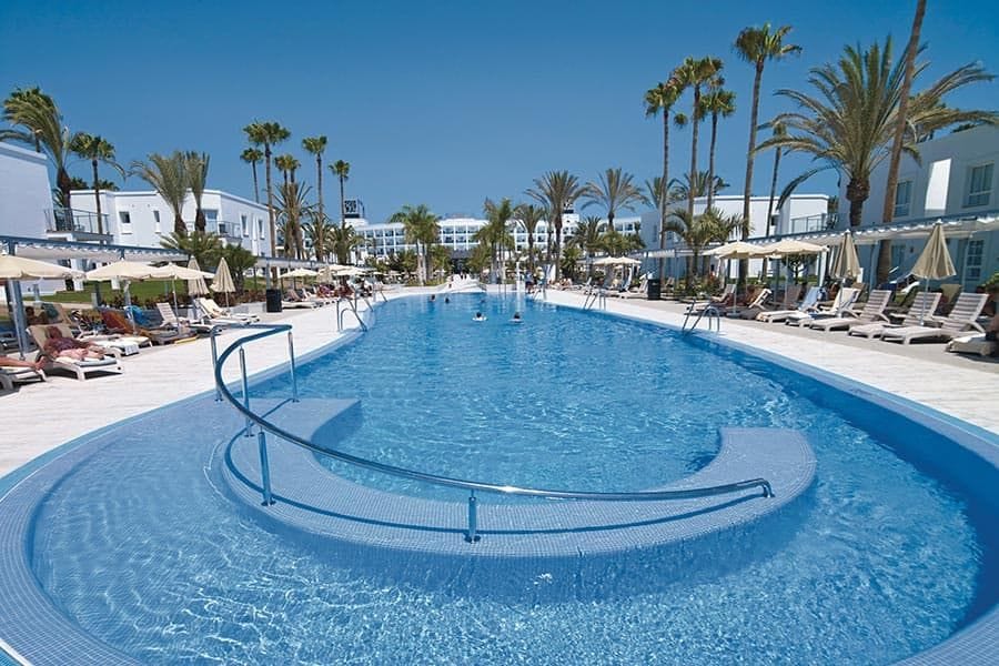 Swimming pool area at Hotel Riu Palace Meloneras