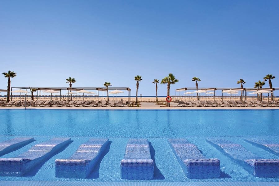 Swimming pool area at Hotel Riu Palace Santa Maria
