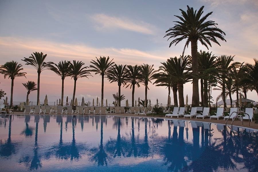 Swimming pool area at Hotel Riu Palace Tres Islas