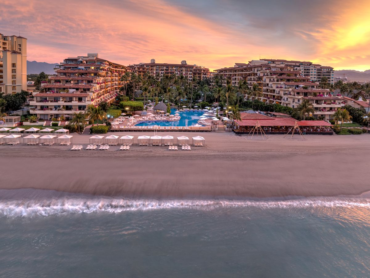 Drone view of Velas Vallarta pools, gardens, and Pacific coastline